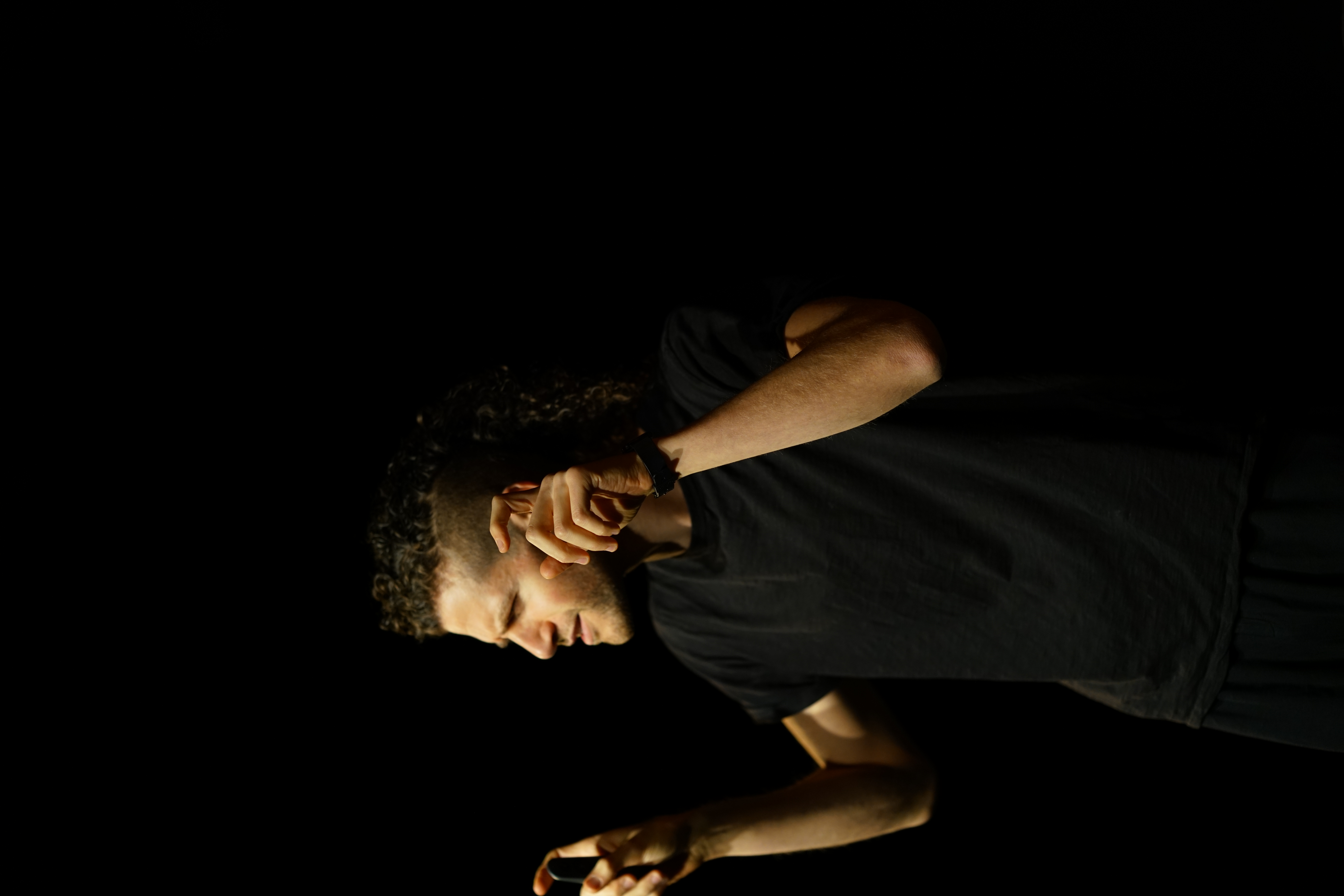 Invasions performance, the poet on stage mid-reading