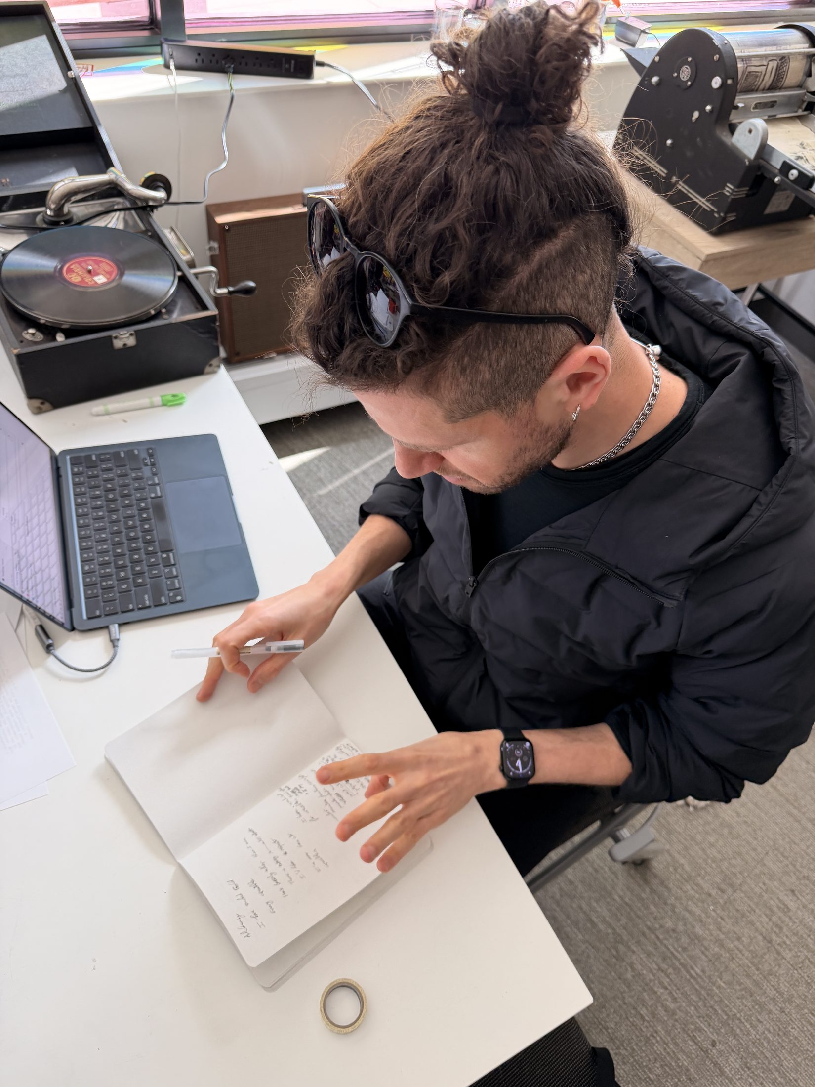 The poet writing among vintage machines at the Media Archaeology Lab